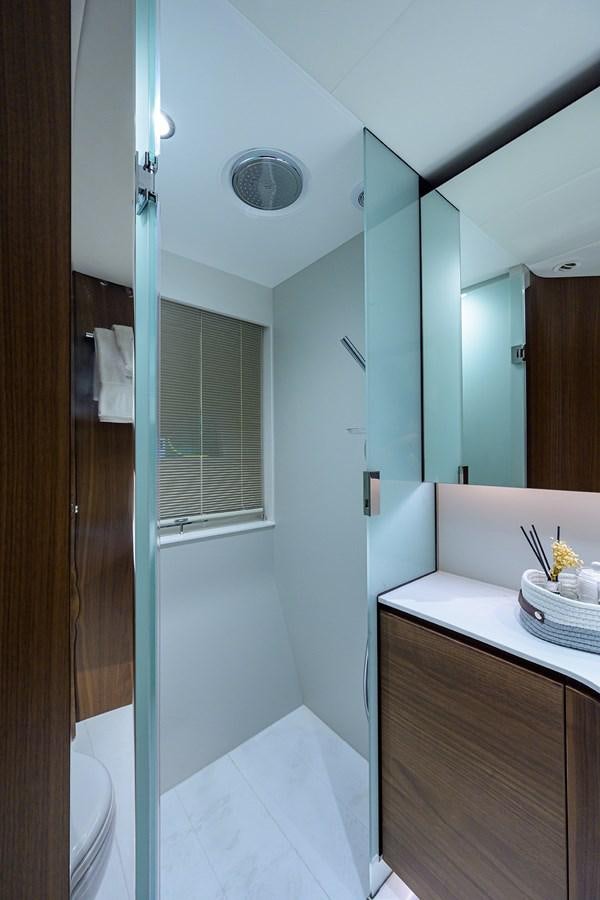 a bathroom with a sink and a mirror aboard ESCAPE Yacht for Sale