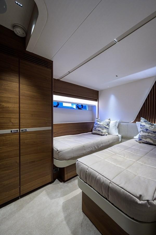 a room with two beds aboard ESCAPE Yacht for Sale