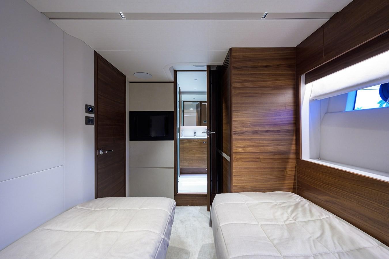 a room with a bed and a closet aboard ESCAPE Yacht for Sale