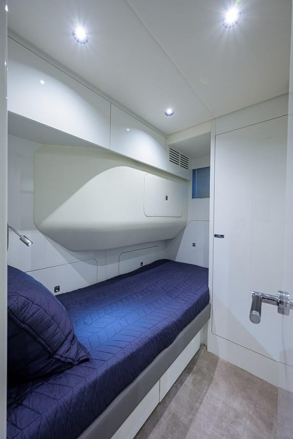 a small room with a bed aboard ESCAPE Yacht for Sale