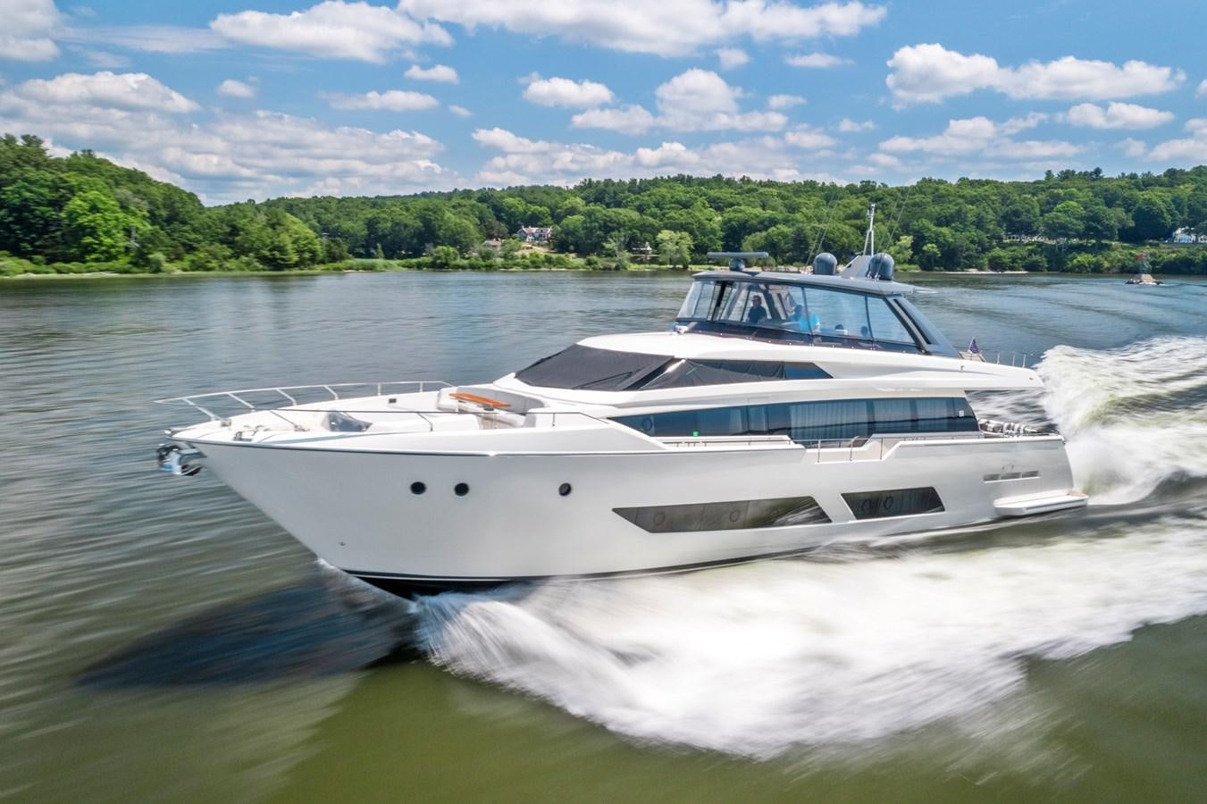 a white yacht on the water aboard PINCH ME Yacht for Sale