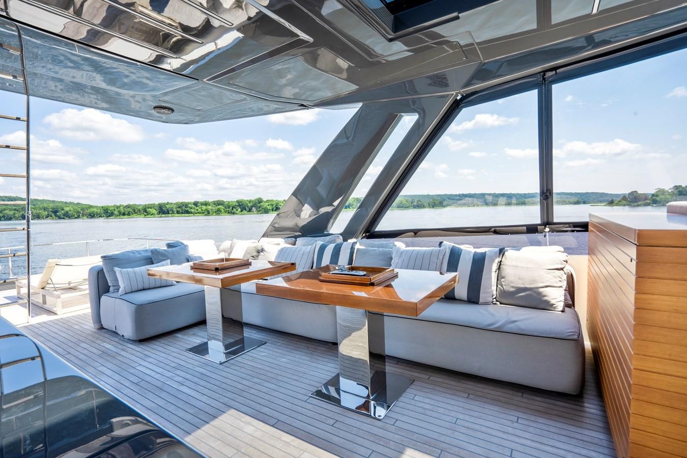 a room with a bed and a table aboard PINCH ME Yacht for Sale