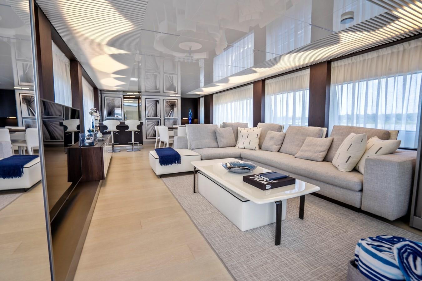 a living room with a couch and a table aboard PINCH ME Yacht for Sale