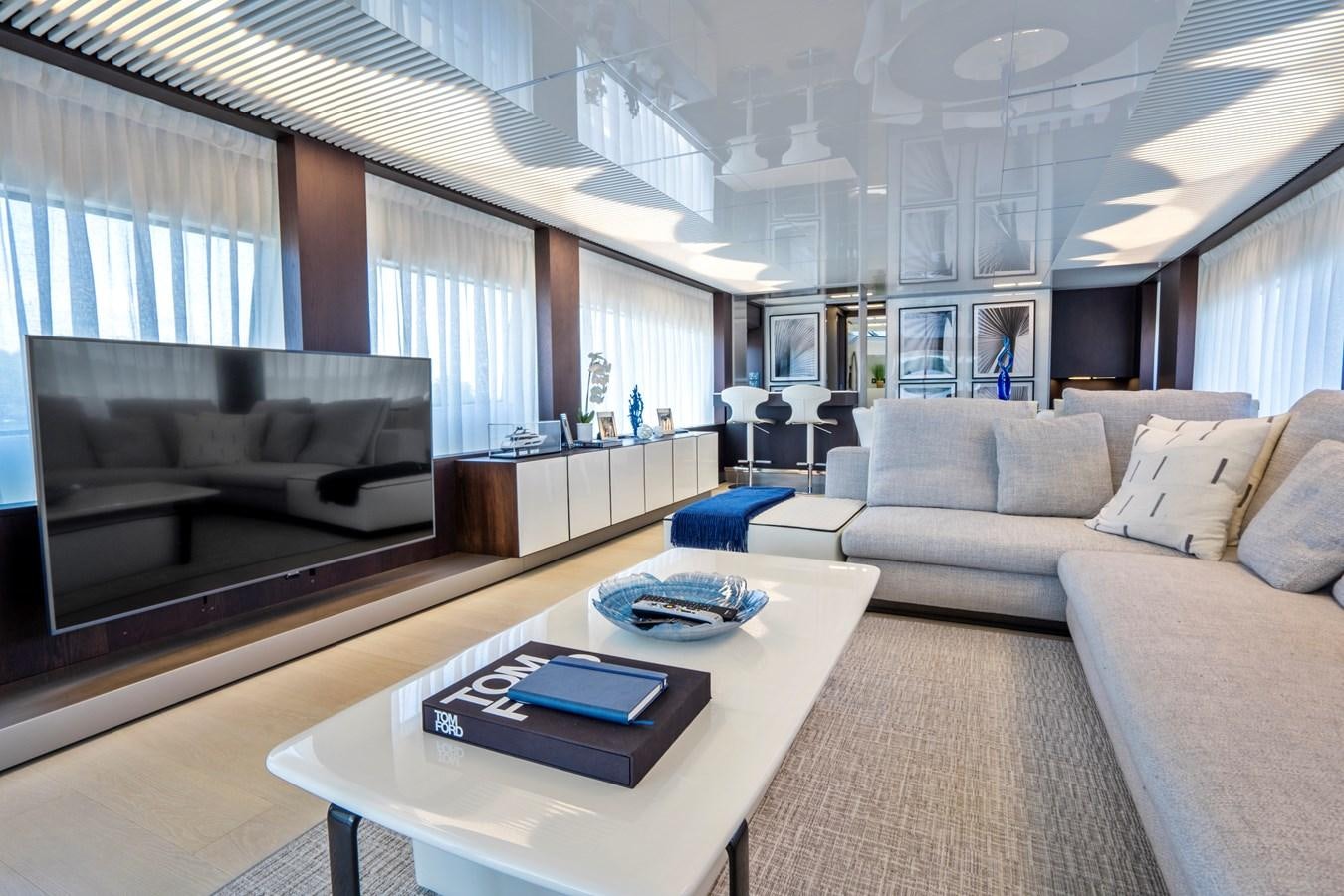 a living room with a couch and a coffee table aboard PINCH ME Yacht for Sale