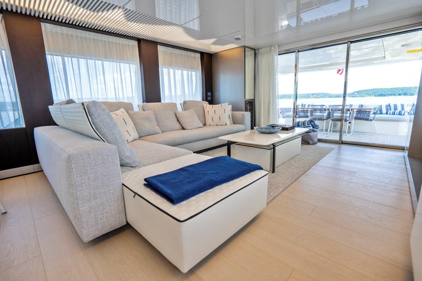 a living room with a large window aboard PINCH ME Yacht for Sale
