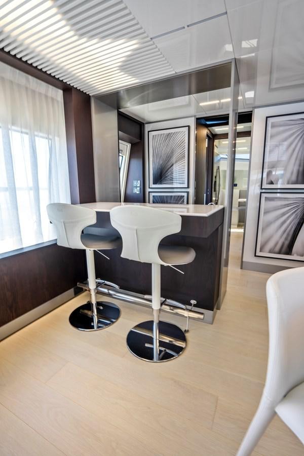 a room with a table and chairs aboard PINCH ME Yacht for Sale