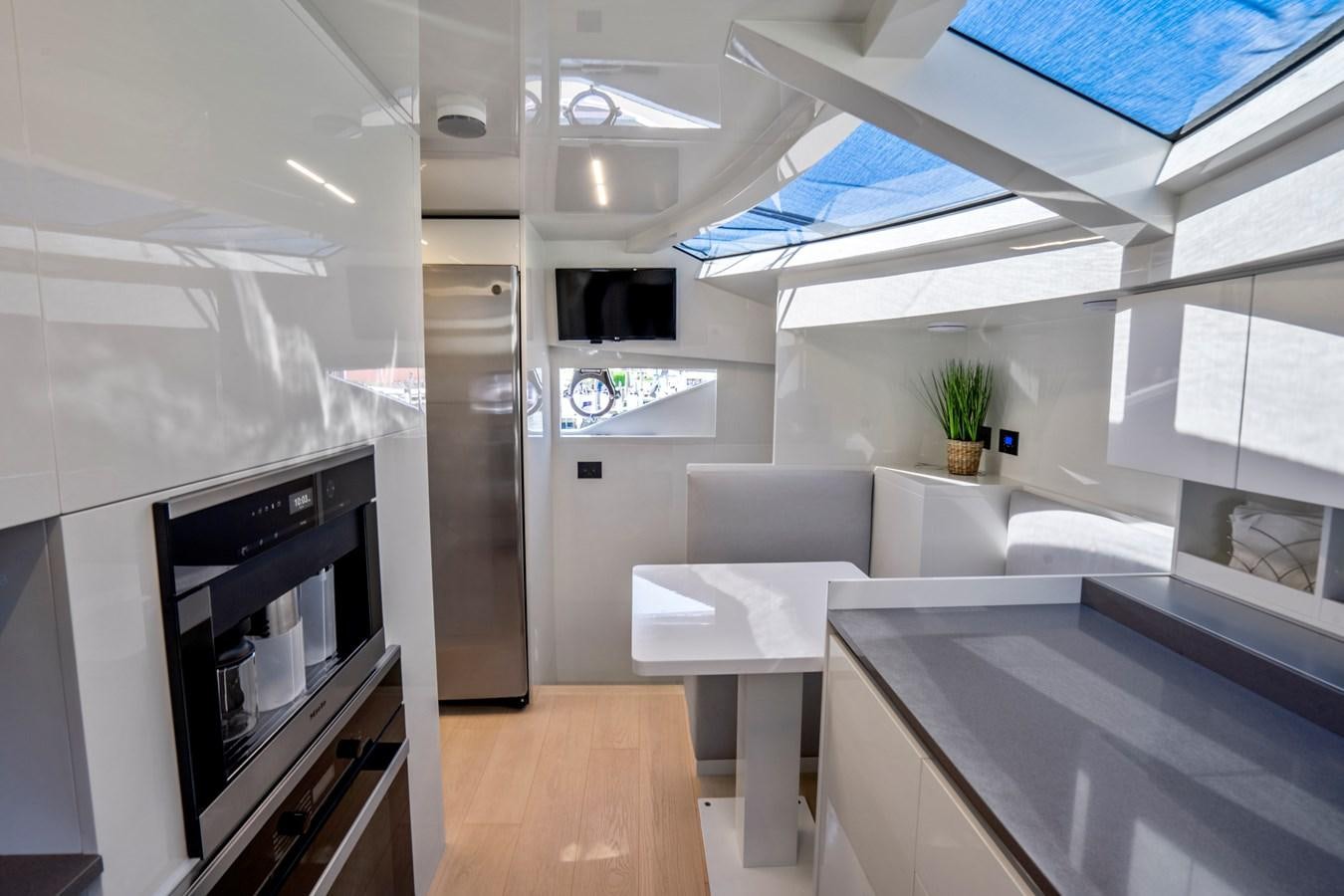a modern looking kitchen with a large open space aboard PINCH ME Yacht for Sale