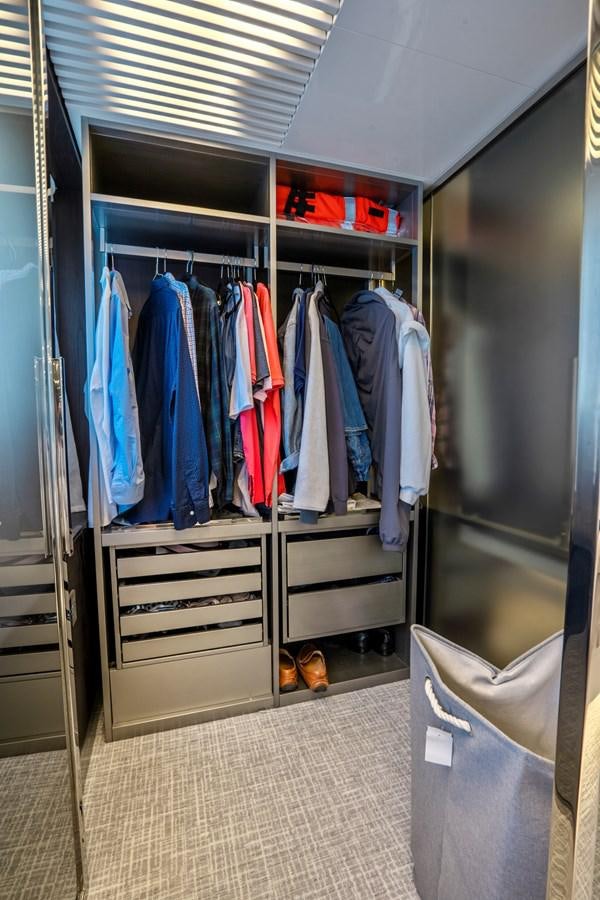 a closet full of clothes aboard PINCH ME Yacht for Sale