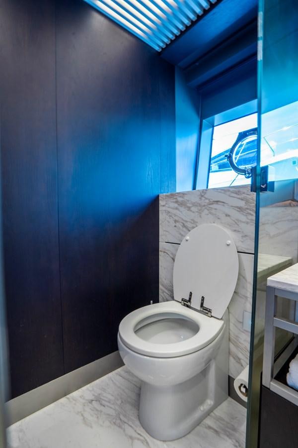 a toilet in a bathroom aboard PINCH ME Yacht for Sale
