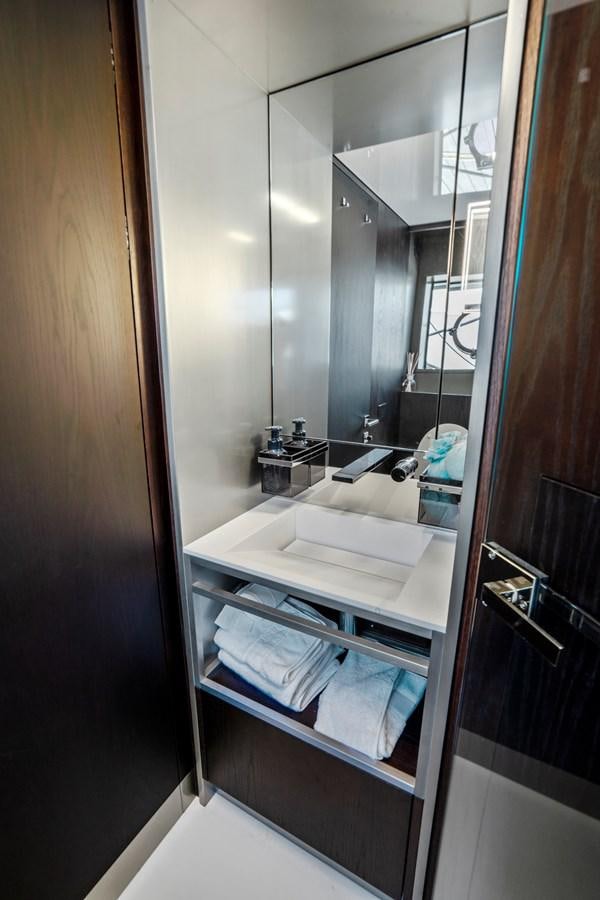 a bathroom with a large mirror aboard PINCH ME Yacht for Sale