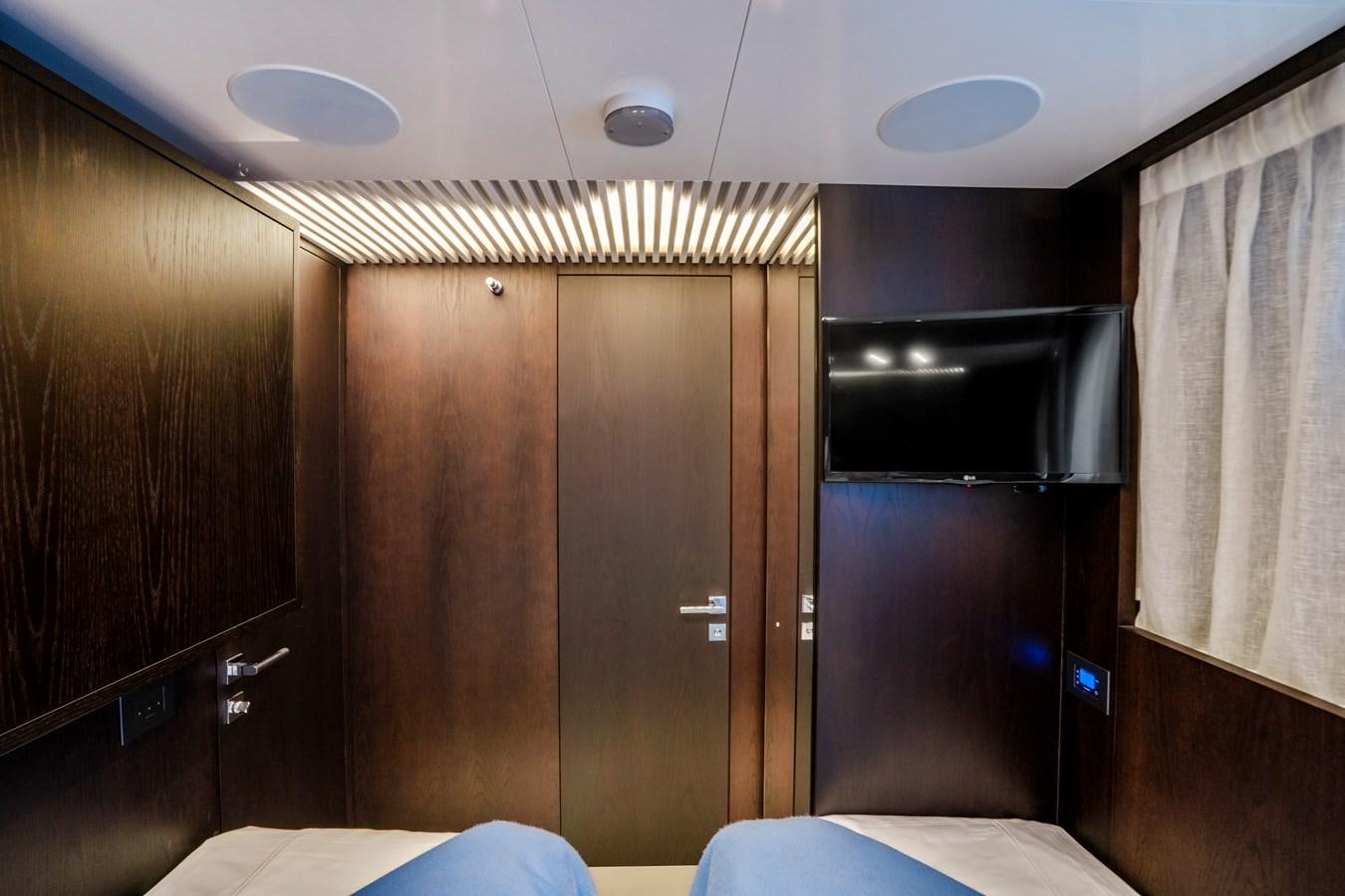 a room with a bed and a closet aboard PINCH ME Yacht for Sale