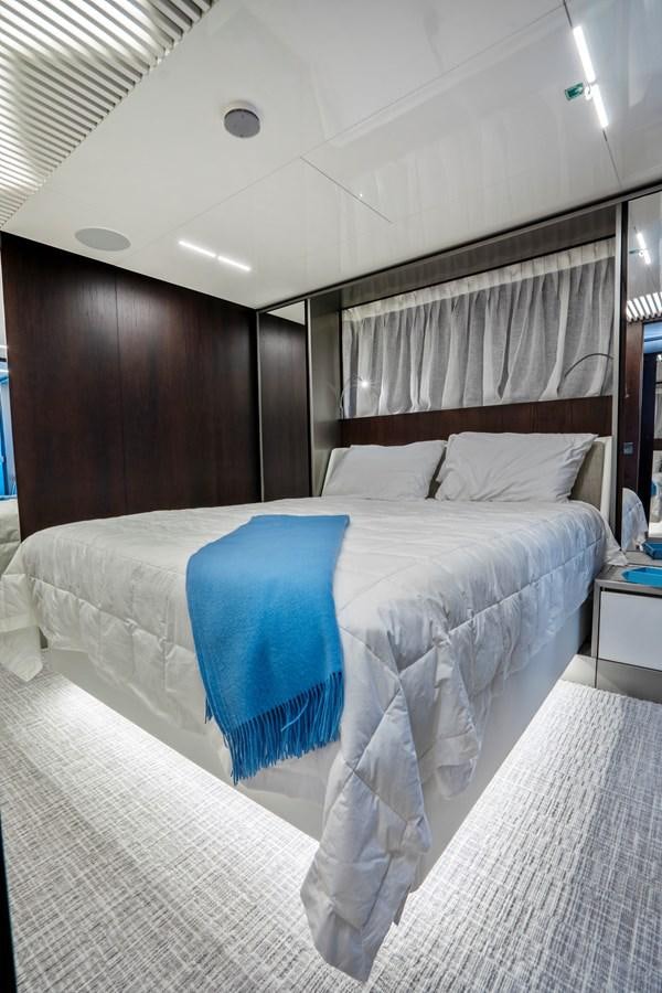 a bed with white sheets aboard PINCH ME Yacht for Sale
