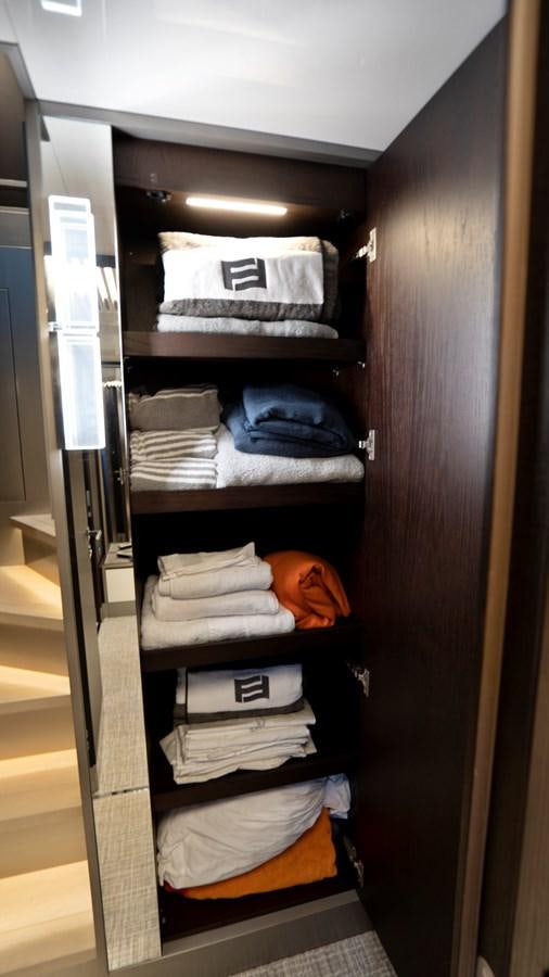 a closet with clothes on it aboard PINCH ME Yacht for Sale