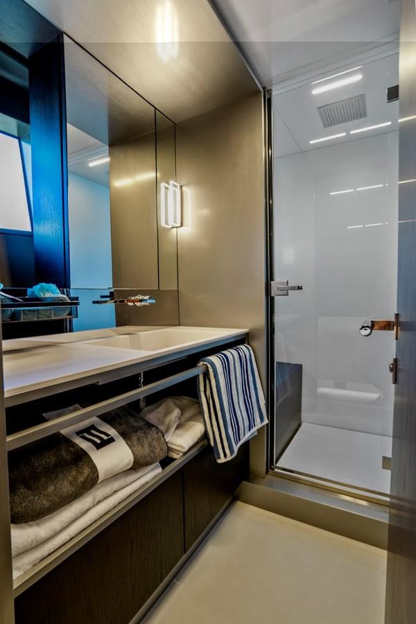 a bathroom with a large mirror aboard PINCH ME Yacht for Sale