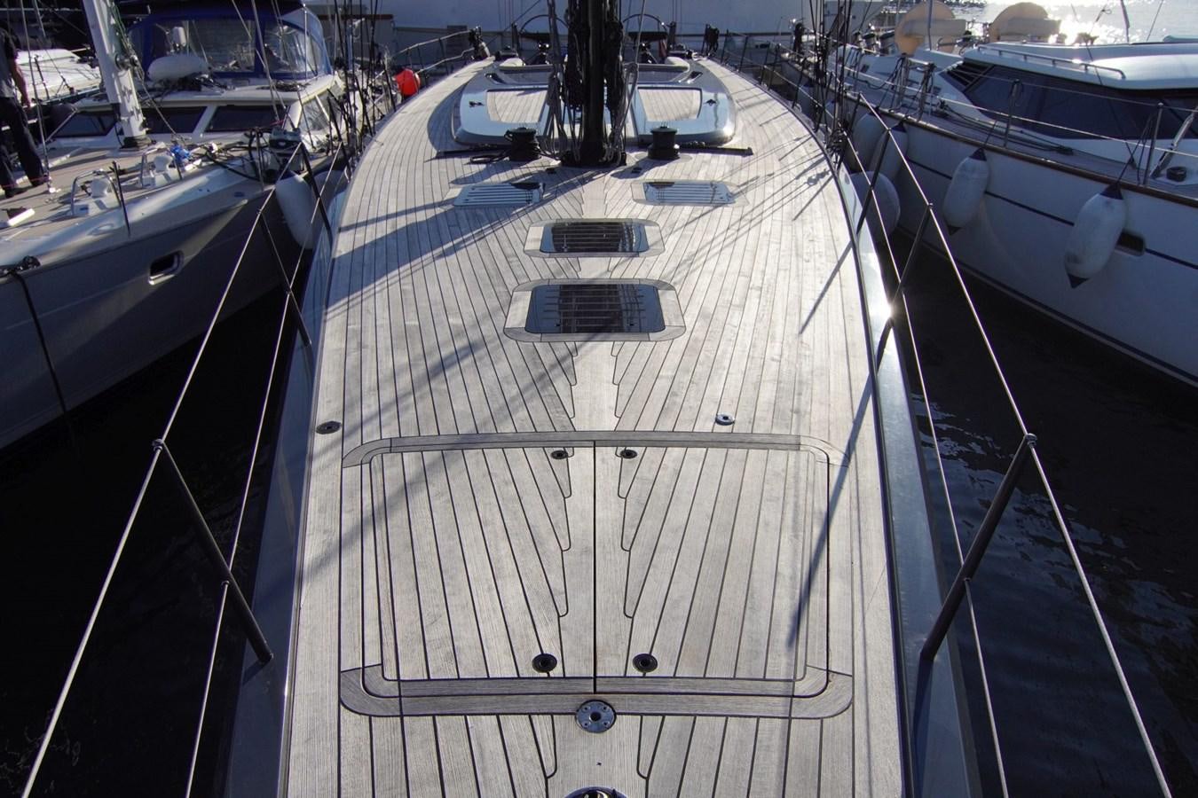 a large boat in a harbor aboard NYUMBA Yacht for Sale