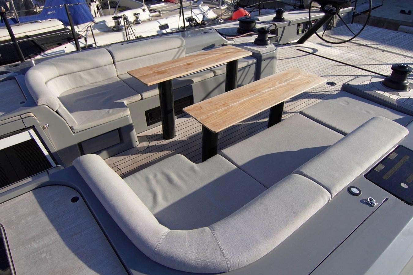 a table with a bench aboard NYUMBA Yacht for Sale