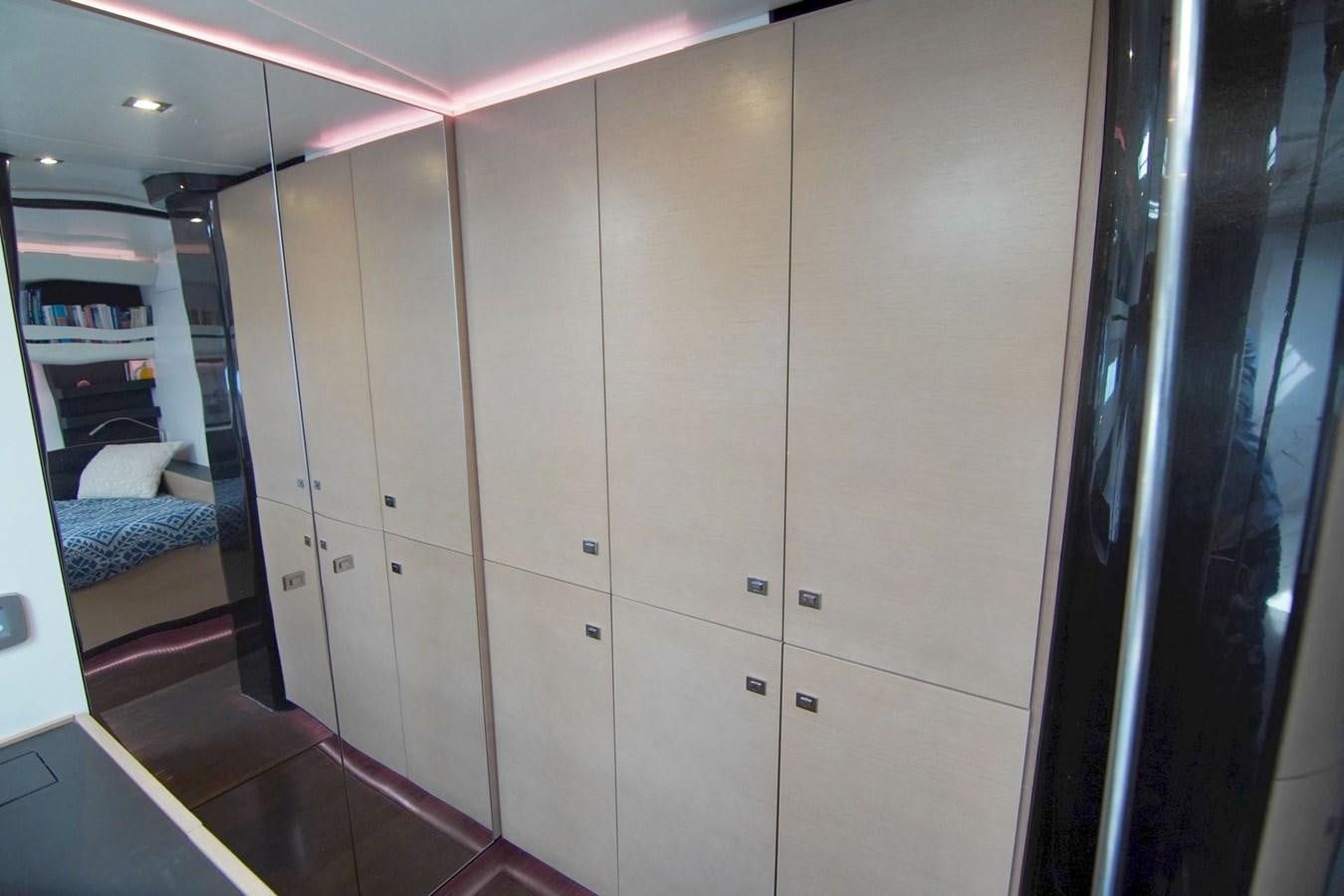 a room with a closet and a couch aboard NYUMBA Yacht for Sale