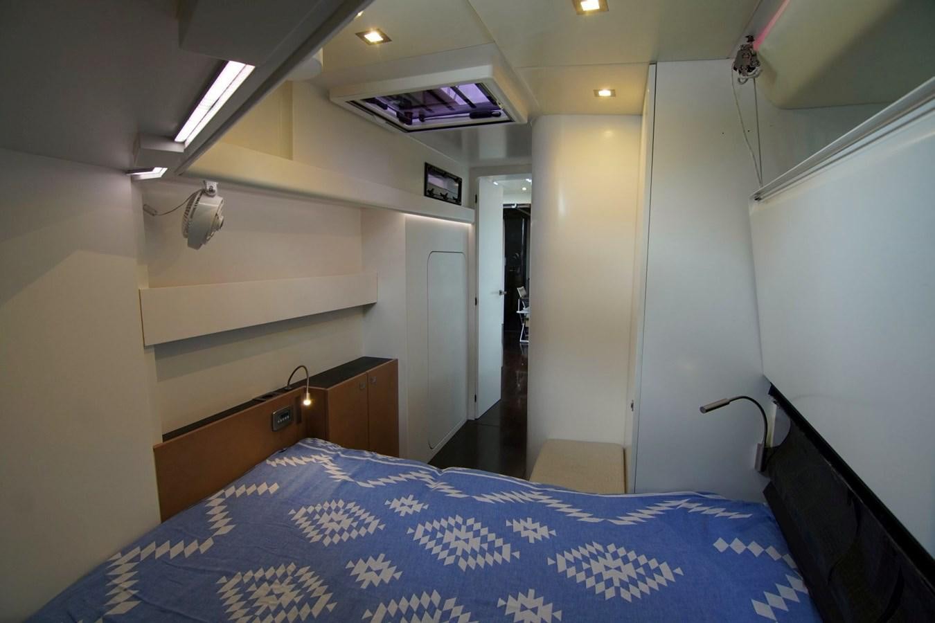 a bed in a room aboard NYUMBA Yacht for Sale