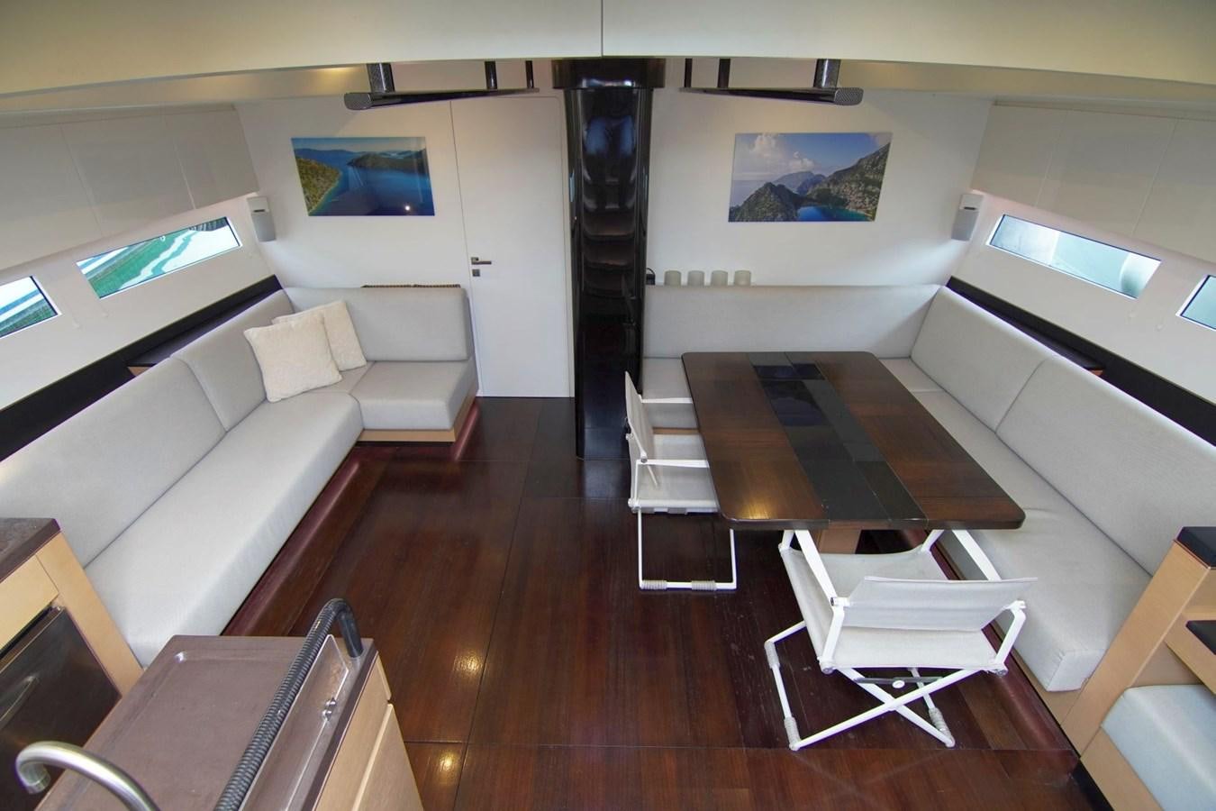 a room with a couch and a table aboard NYUMBA Yacht for Sale