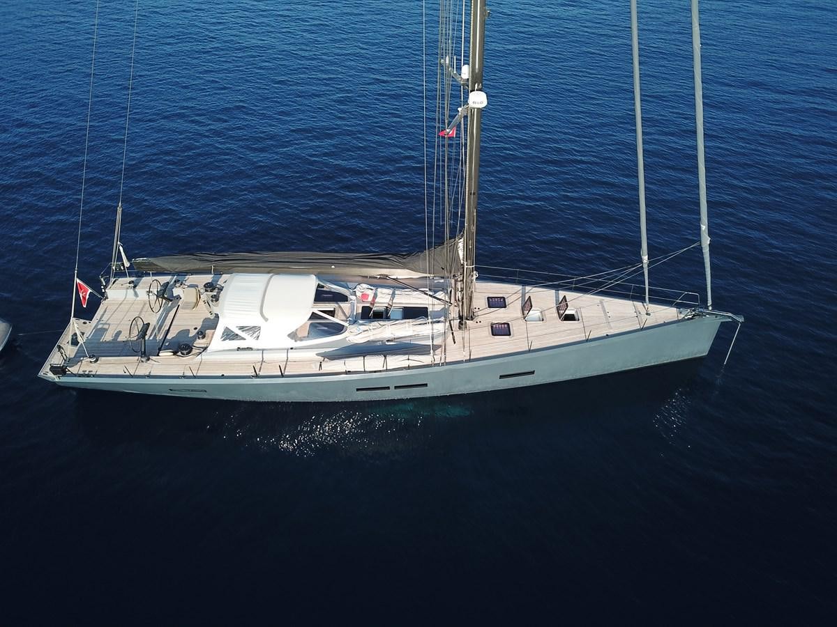a white boat in the water aboard NYUMBA Yacht for Sale