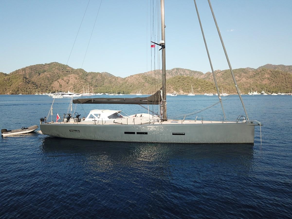 a white boat in the water aboard NYUMBA Yacht for Sale