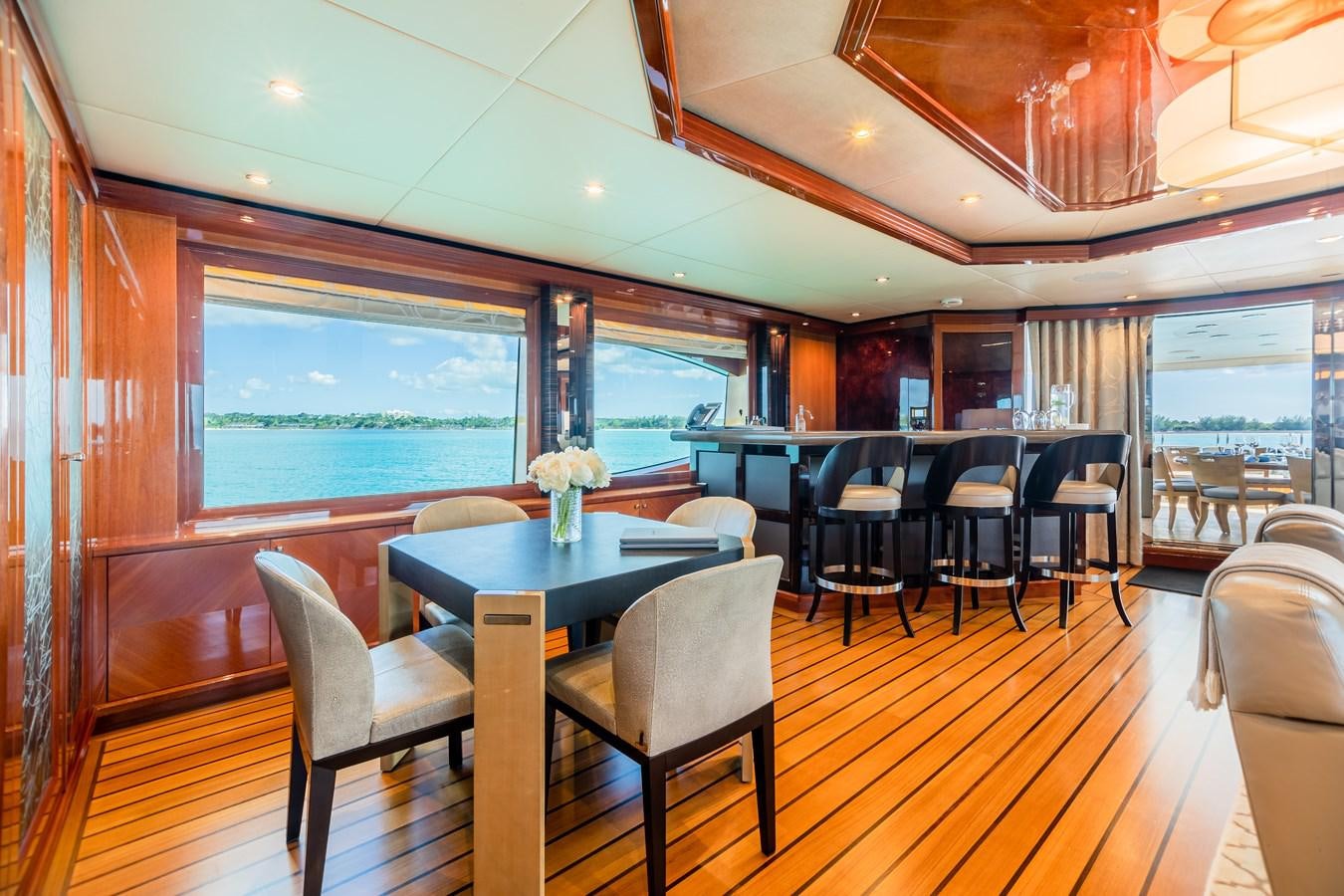 a room with a table and chairs aboard IMPROMPTU Yacht for Charter
