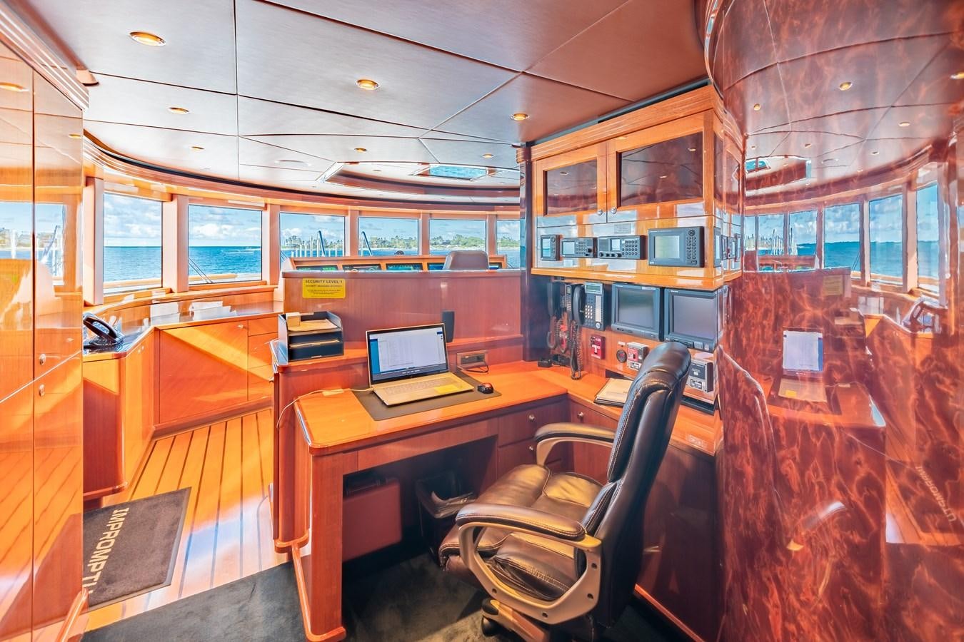 a room with a desk and a laptop aboard IMPROMPTU Yacht for Charter