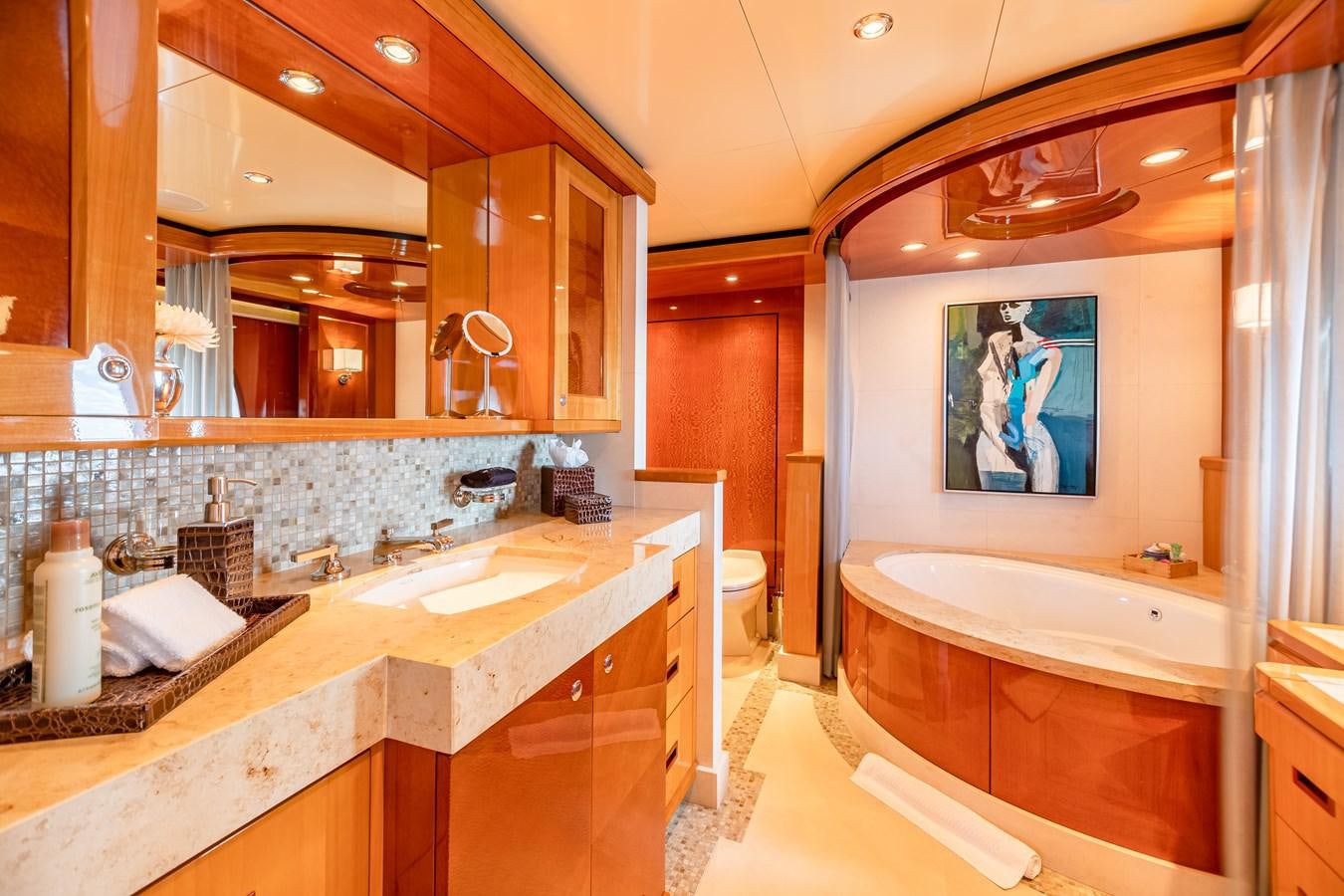 a bathroom with a large mirror aboard IMPROMPTU Yacht for Charter