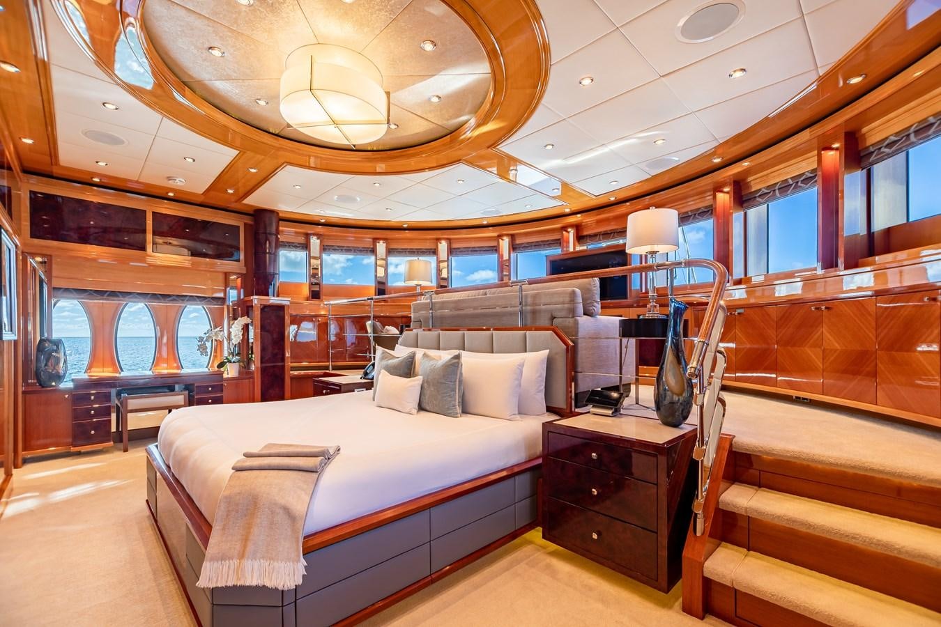 a room with a bed and a large window aboard IMPROMPTU Yacht for Charter