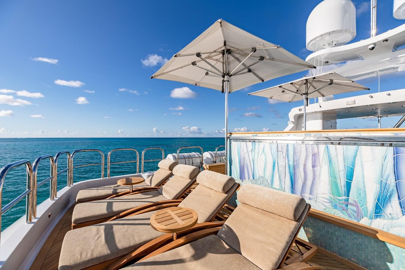 a boat with a white umbrella on it aboard IMPROMPTU Yacht for Charter