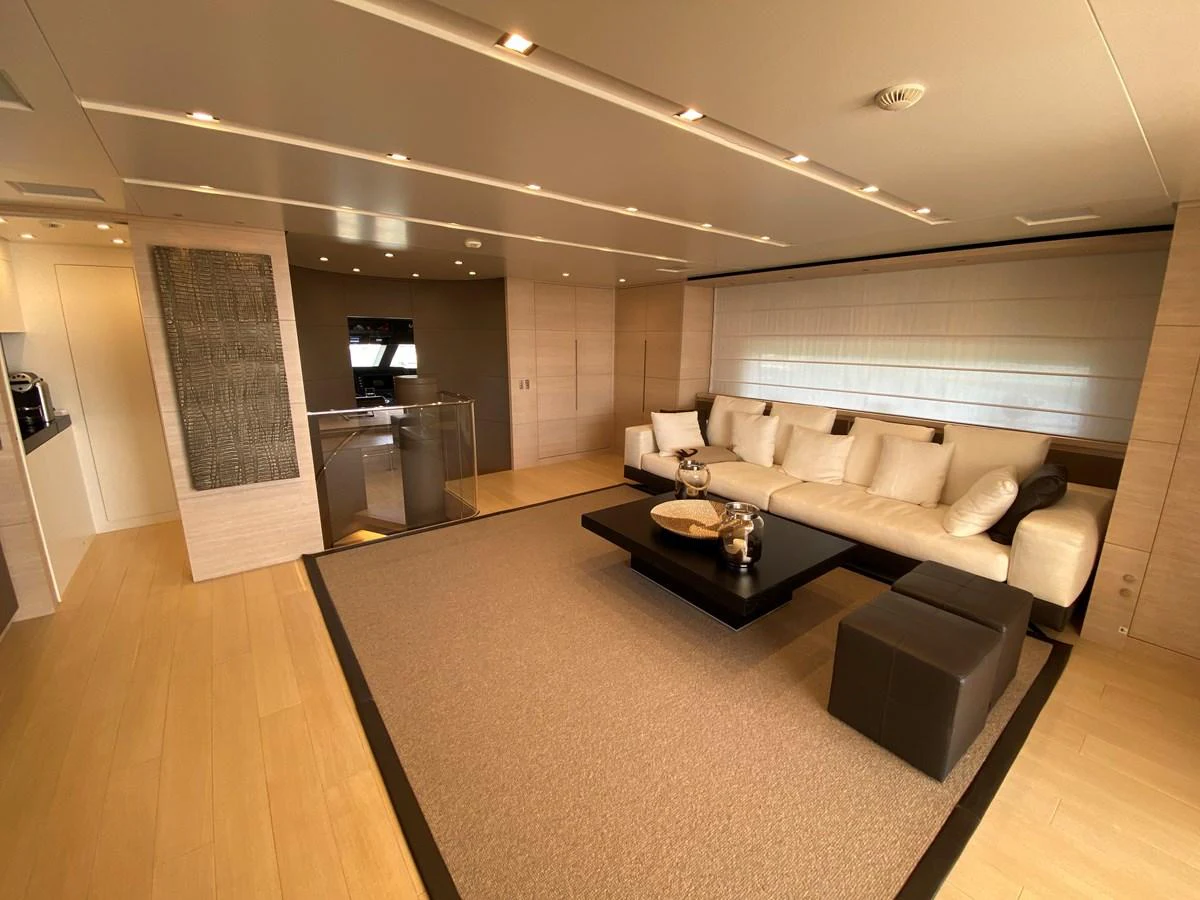 a living room with a couch and a table aboard NYALA OF AFRICA Yacht for Sale