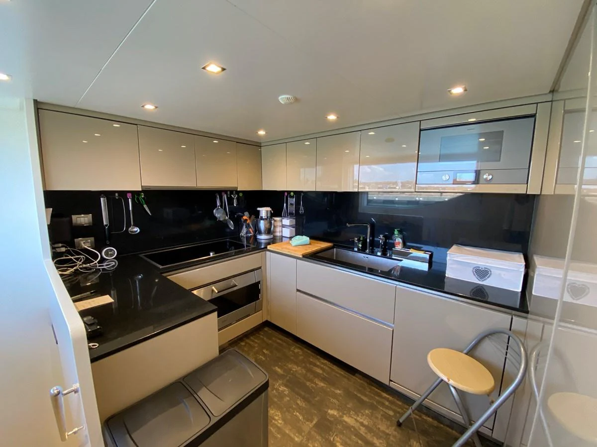 a kitchen with a large island aboard NYALA OF AFRICA Yacht for Sale