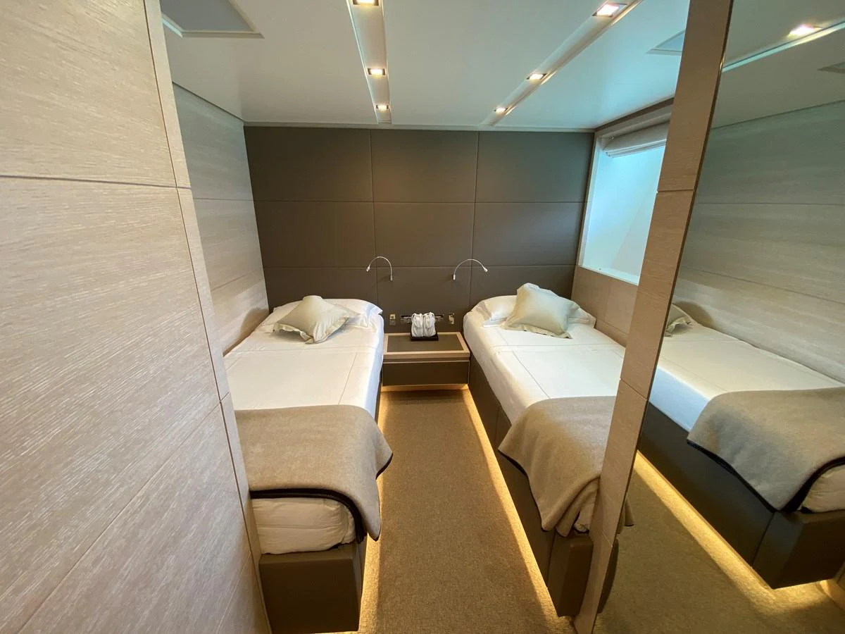 a room with a bed and a window aboard NYALA OF AFRICA Yacht for Sale