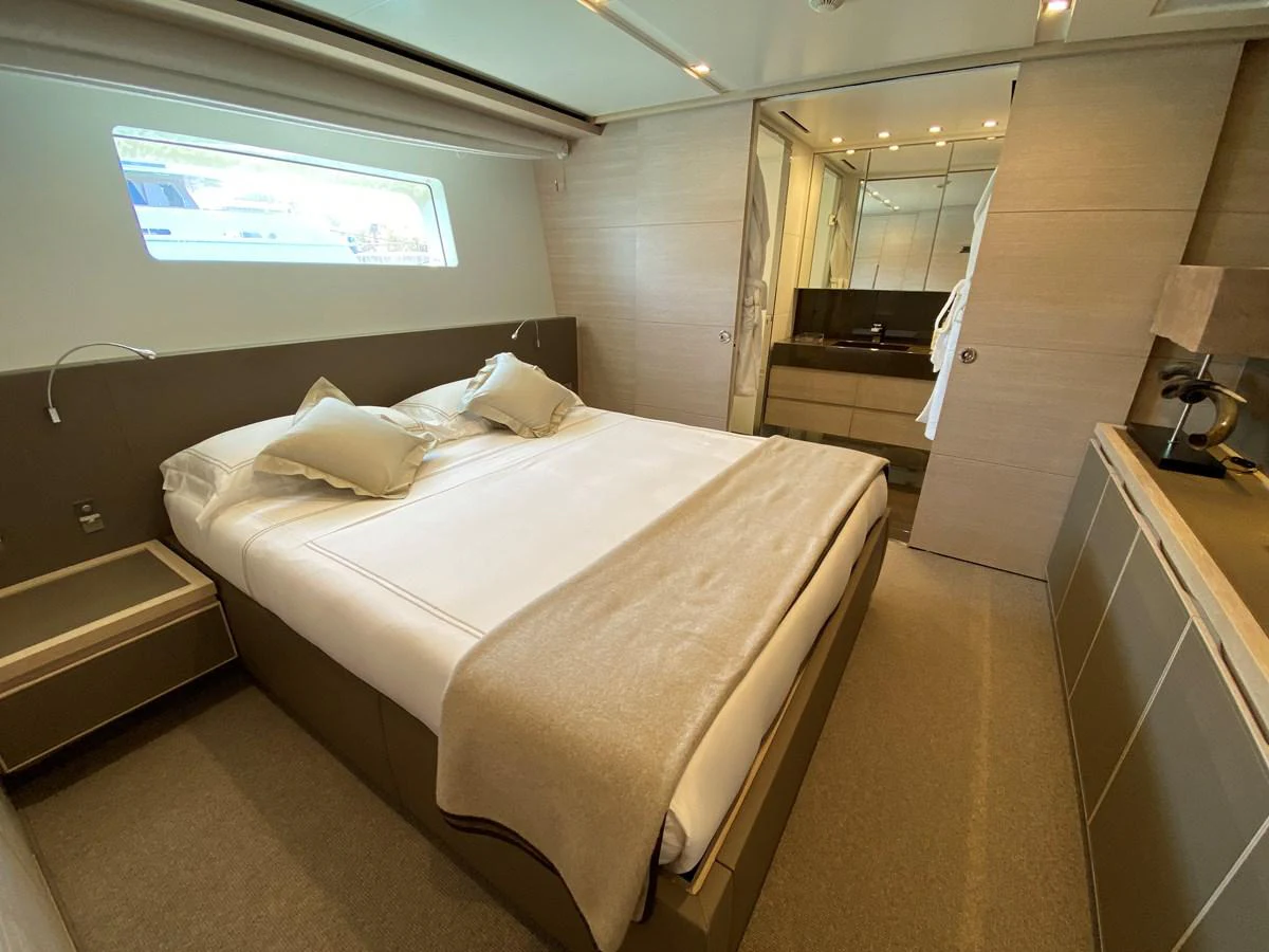 a room with a bed and a desk aboard NYALA OF AFRICA Yacht for Sale