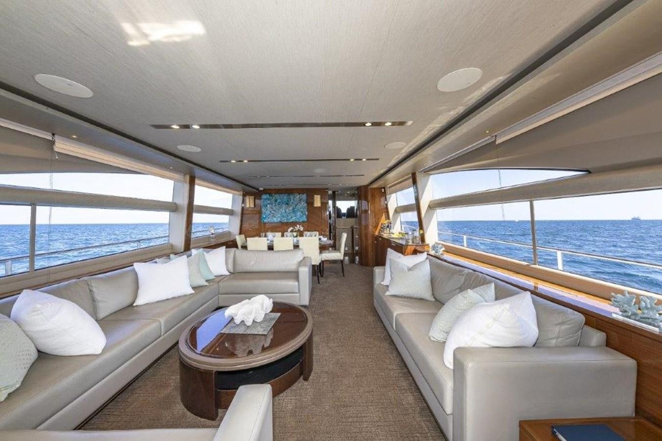a large living room with a large window aboard SIMPLER Yacht for Sale