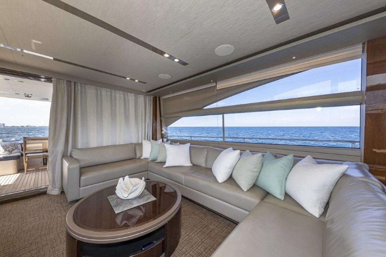 a room with a couch and a table aboard SIMPLER Yacht for Sale