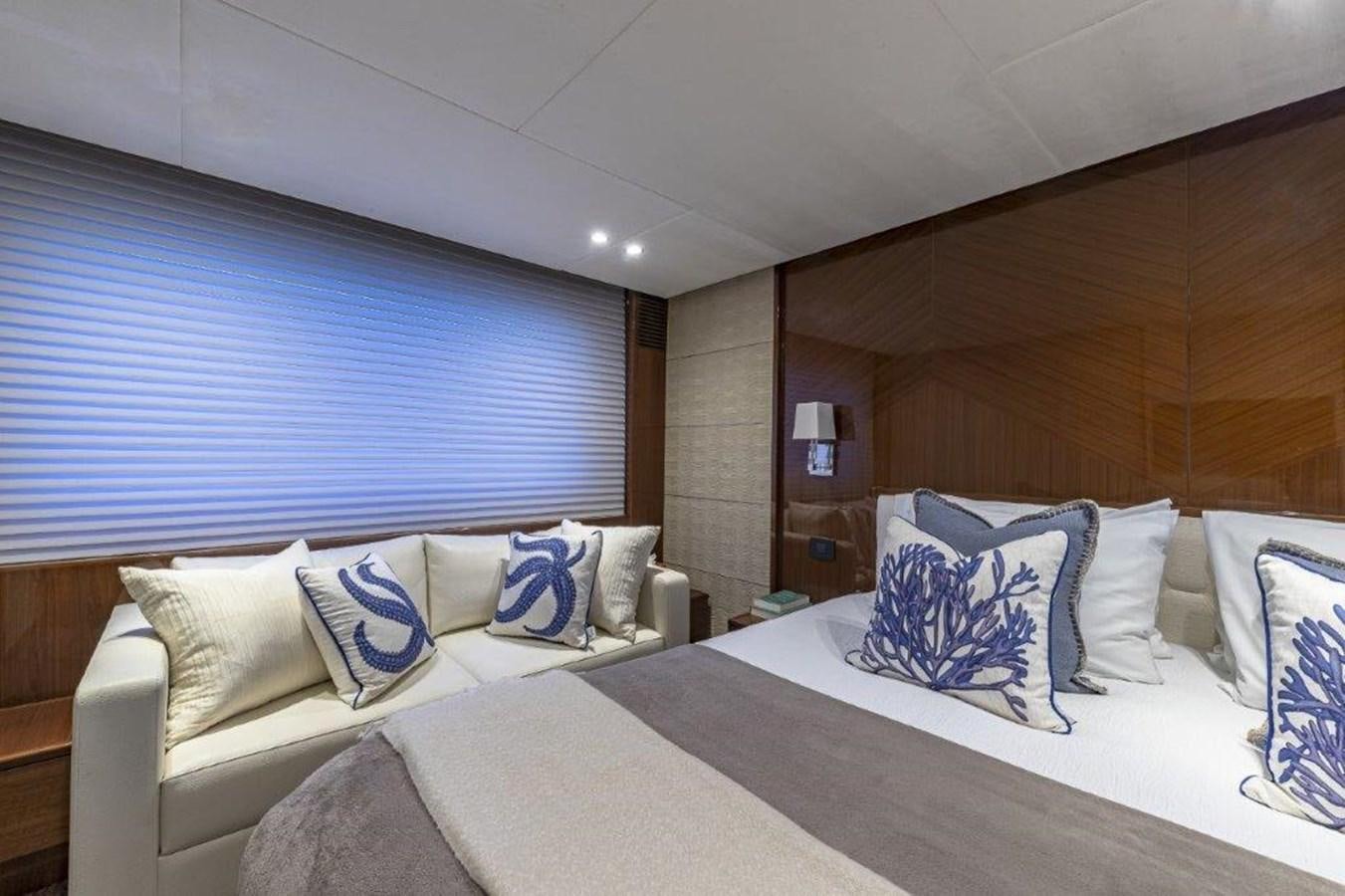 a room with a bed and a mirror aboard SIMPLER Yacht for Sale