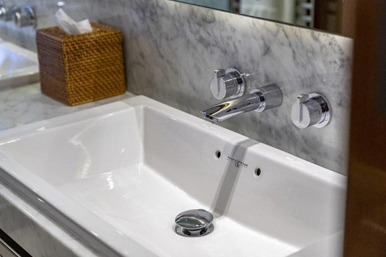a bathtub with a faucet and a basket aboard SIMPLER Yacht for Sale