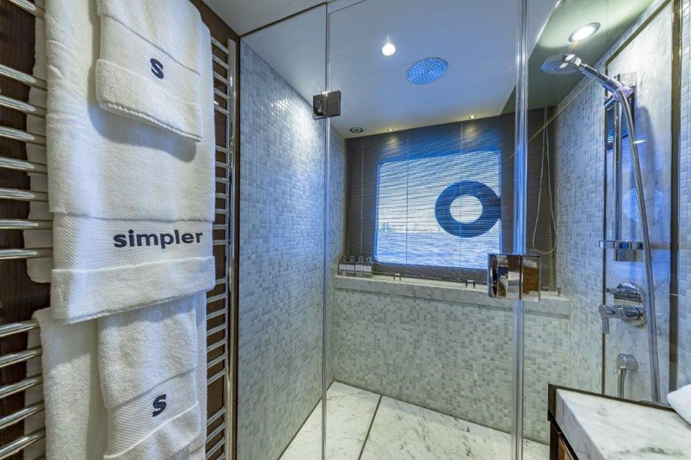 a bathroom with a shower unit and a sink aboard SIMPLER Yacht for Sale
