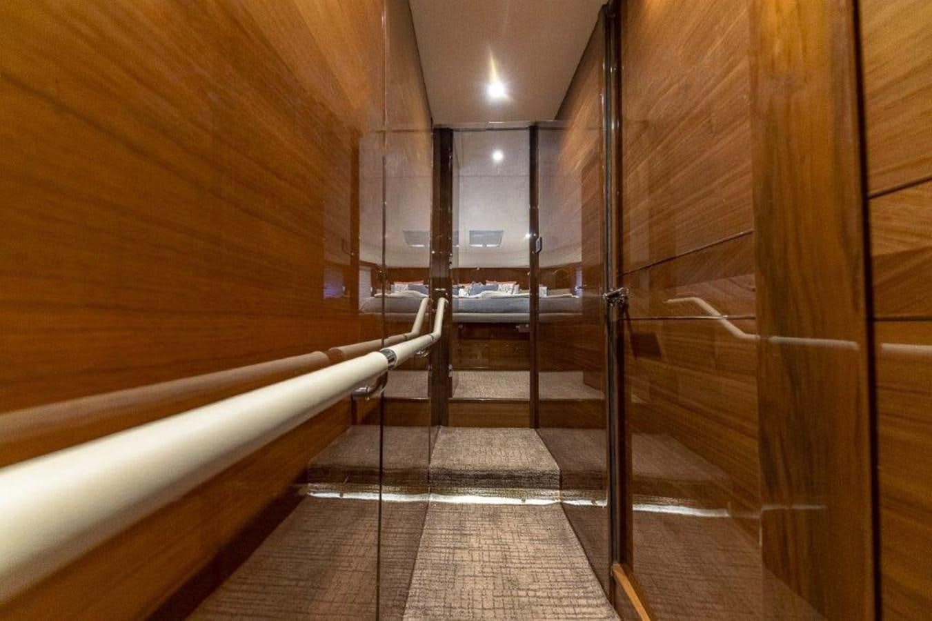 a hallway with wood walls aboard SIMPLER Yacht for Sale