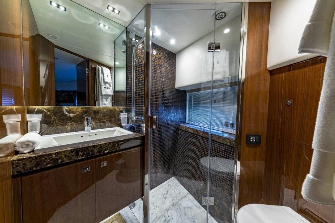 a bathroom with a large mirror aboard SIMPLER Yacht for Sale