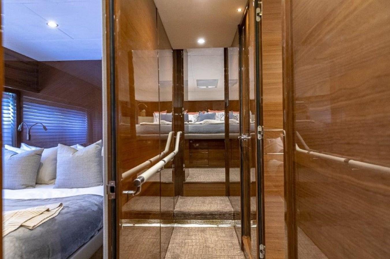 a room with a bed and a door aboard SIMPLER Yacht for Sale