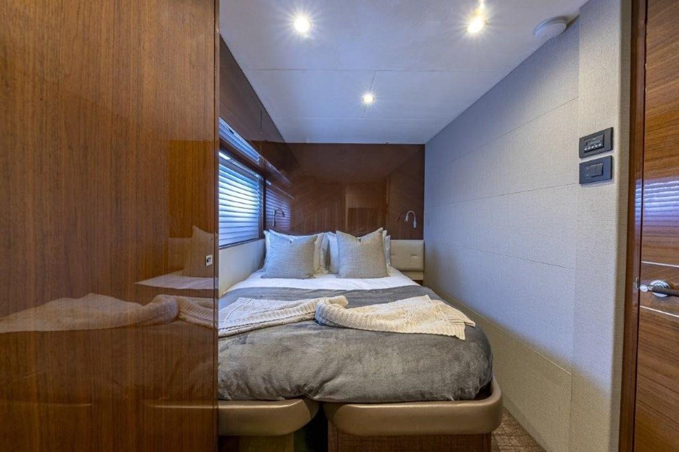 a room with a bed and a window aboard SIMPLER Yacht for Sale