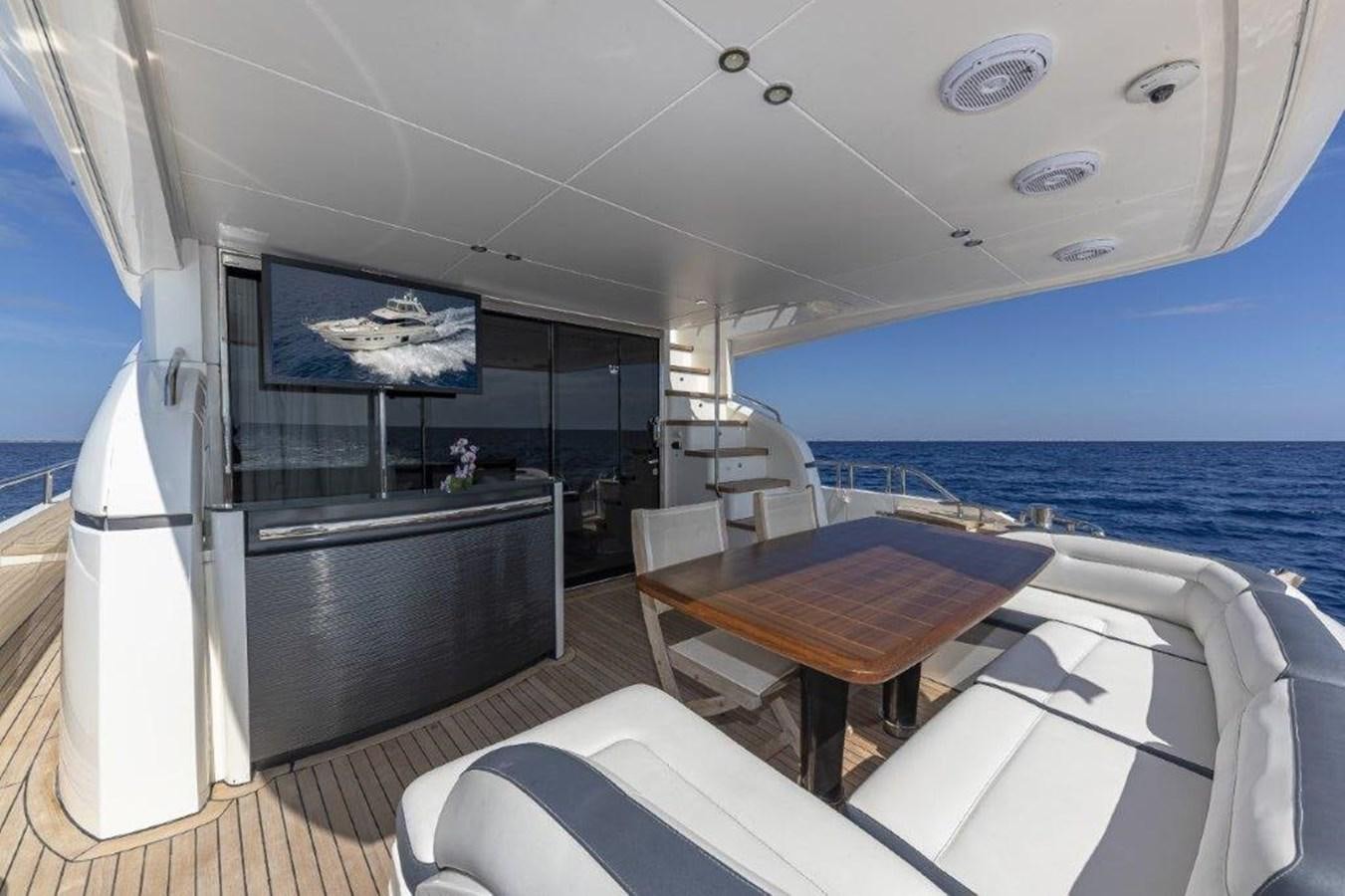 a room with a table and chairs aboard SIMPLER Yacht for Sale