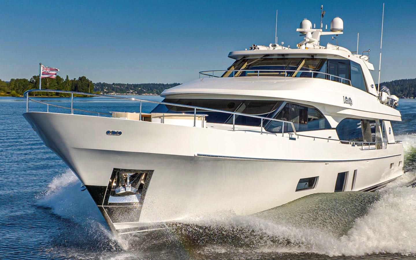 a white boat on a beach aboard LANIKAI Yacht for Sale