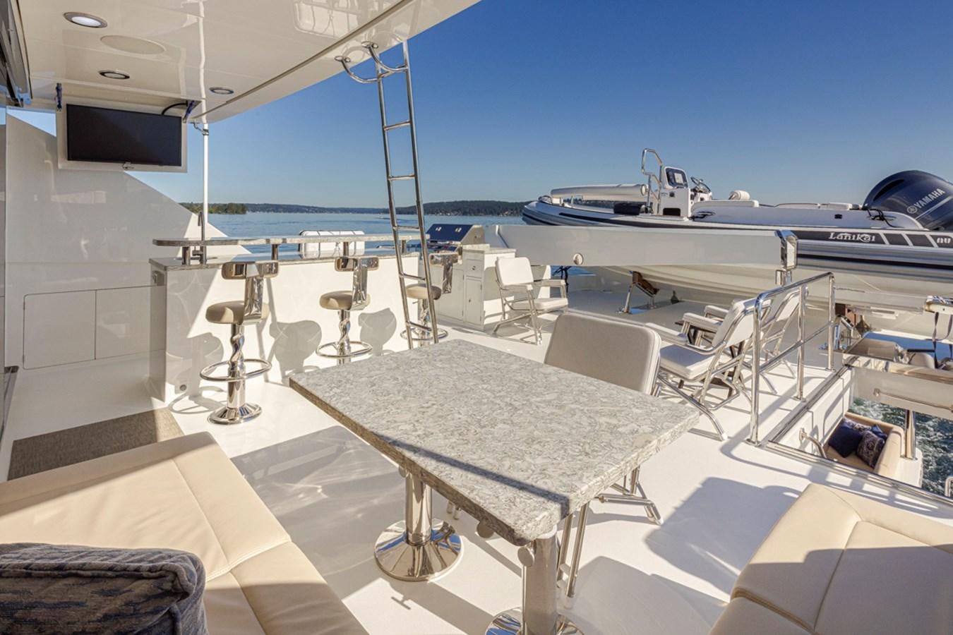 a room with a table and chairs aboard LANIKAI Yacht for Sale