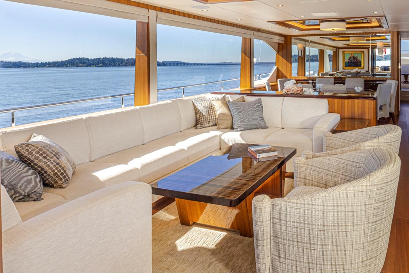 a living room with a large window aboard LANIKAI Yacht for Sale