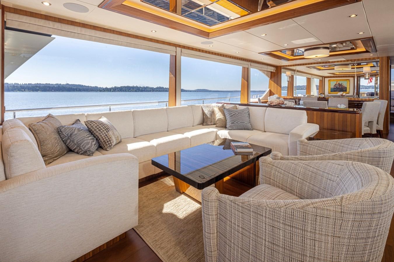 a living room with a large window aboard LANIKAI Yacht for Sale