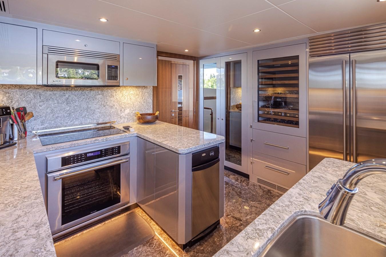 a kitchen with stainless steel appliances aboard LANIKAI Yacht for Sale