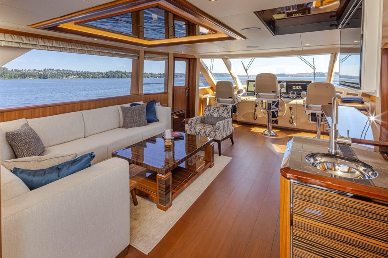 a boat with a couch and a table and chairs aboard LANIKAI Yacht for Sale